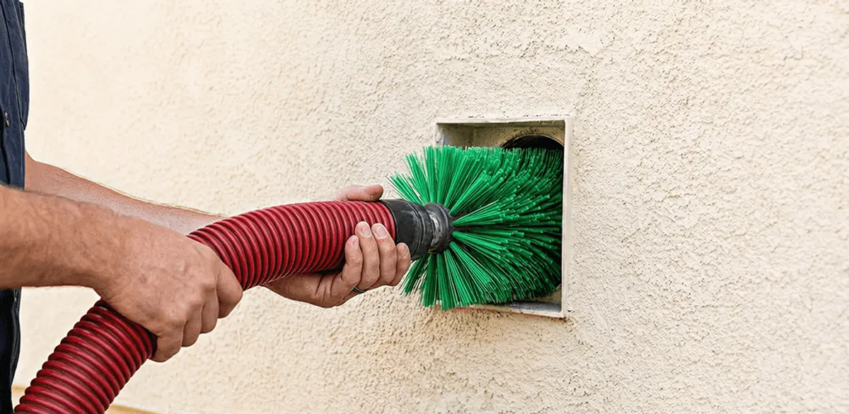 Air duct cleaning brush removing debris from a vent opening in Omaha, NE
